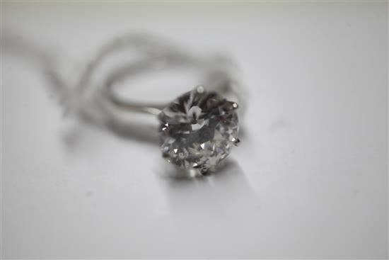 A platinum and solitaire diamond ring